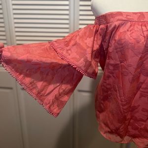 Off-the-shoulder pink blouse